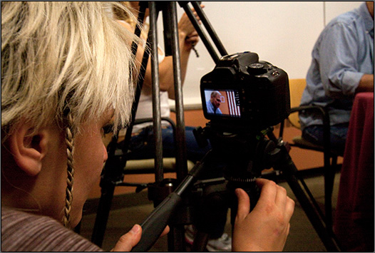 Camera Operator Yelena Baykova focuses on Gil Gerard.
